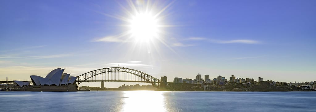 Photo of Sydney Harbour and Government owned public historic landmarks Sydney Opera House and Sydney Harbour Bridge.